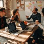 Small business team brainstorming on outsourced IT management solutions in a collaborative office environment